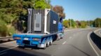 bison t series on the back of a truck driving on motorway